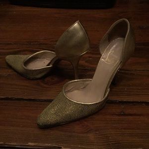 Vintage authentic Christian Louboutin gold pumps.